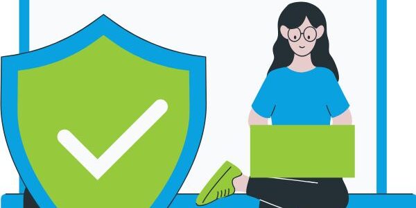person typing on their laptop with a padlock and shield to signify protect your business